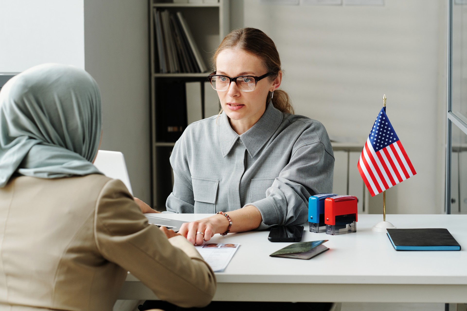 Consular Officer Working With Muslim Woman